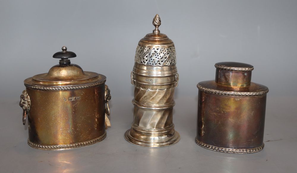 Two Edwardian silver tea caddies, London, 1902 and 1907, tallest 11cm and a late Victorian silver sugar caster, 16oz.